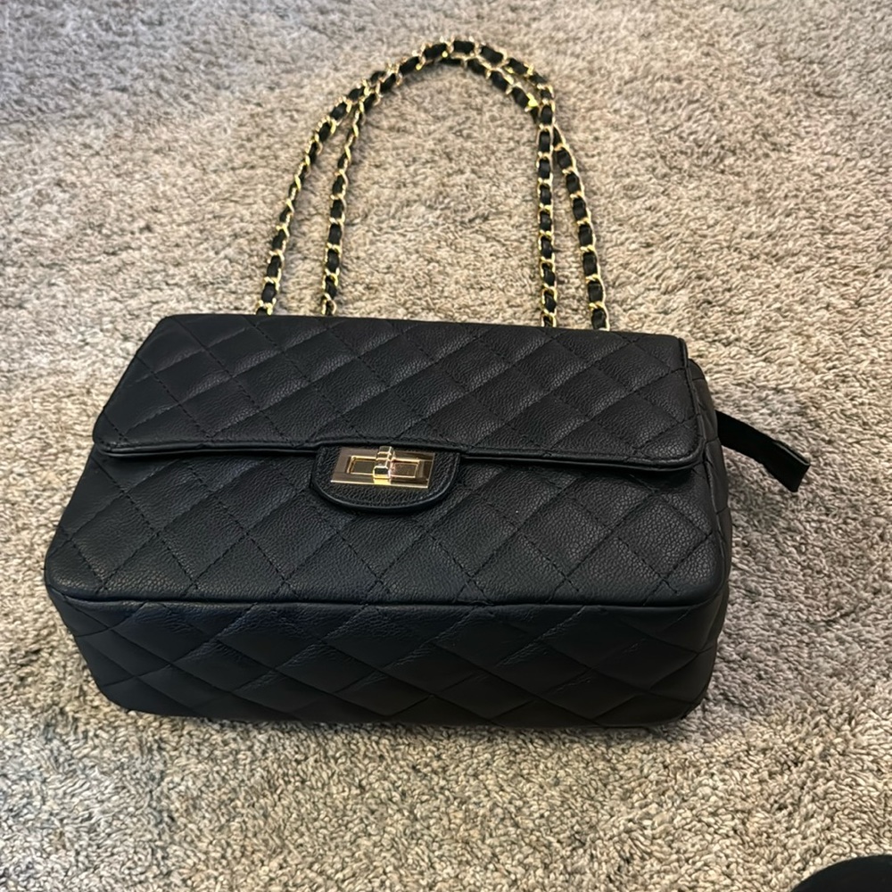 NWT no flaw black purse with 2 black and gold straps.